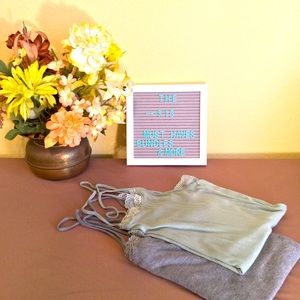 Rarely worn.Vey Soft.Lace trim.Strap promotes cleavage.Bundle of two tanks.